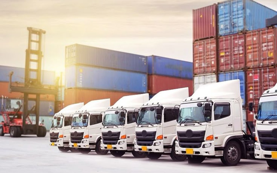 Last-mile delivery vehicles loading at a distribution centre